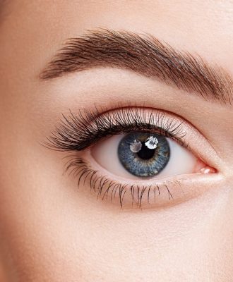 Female eye with long false eyelashes